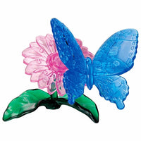 3D butterfly crystal puzzle with blue wings, pink flower, and green base leaves