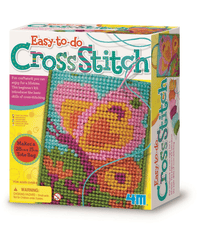 Cross stitch kit box with colorful stitched flower and supplies
