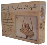 Packaging for a Leonardo da Vinci catapult kit, featuring the product name and an image of the assembled catapult, with da Vinci's original drawings in the background.