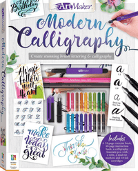 Modern calligraphy kit with marker pens, ink bottle, and instruction pages