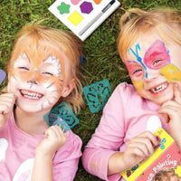 Rainbow face paint kit: two kids smiling with colorful designs on their faces