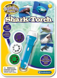 Shark Torch projector toy set package with blue handheld projector and shark images