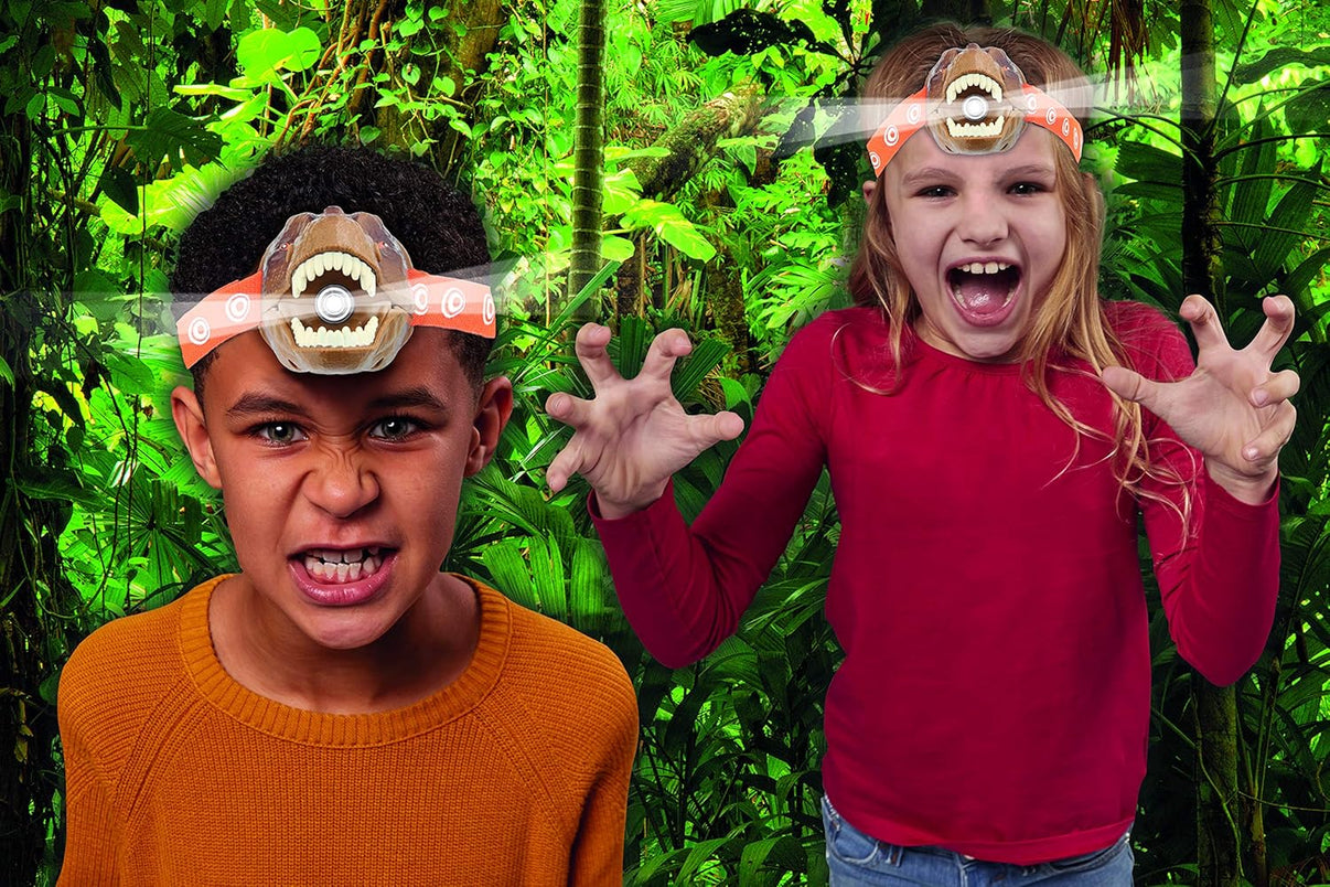 Two kids wearing T-Rex head torches, brown dino faces, orange patterned headbands