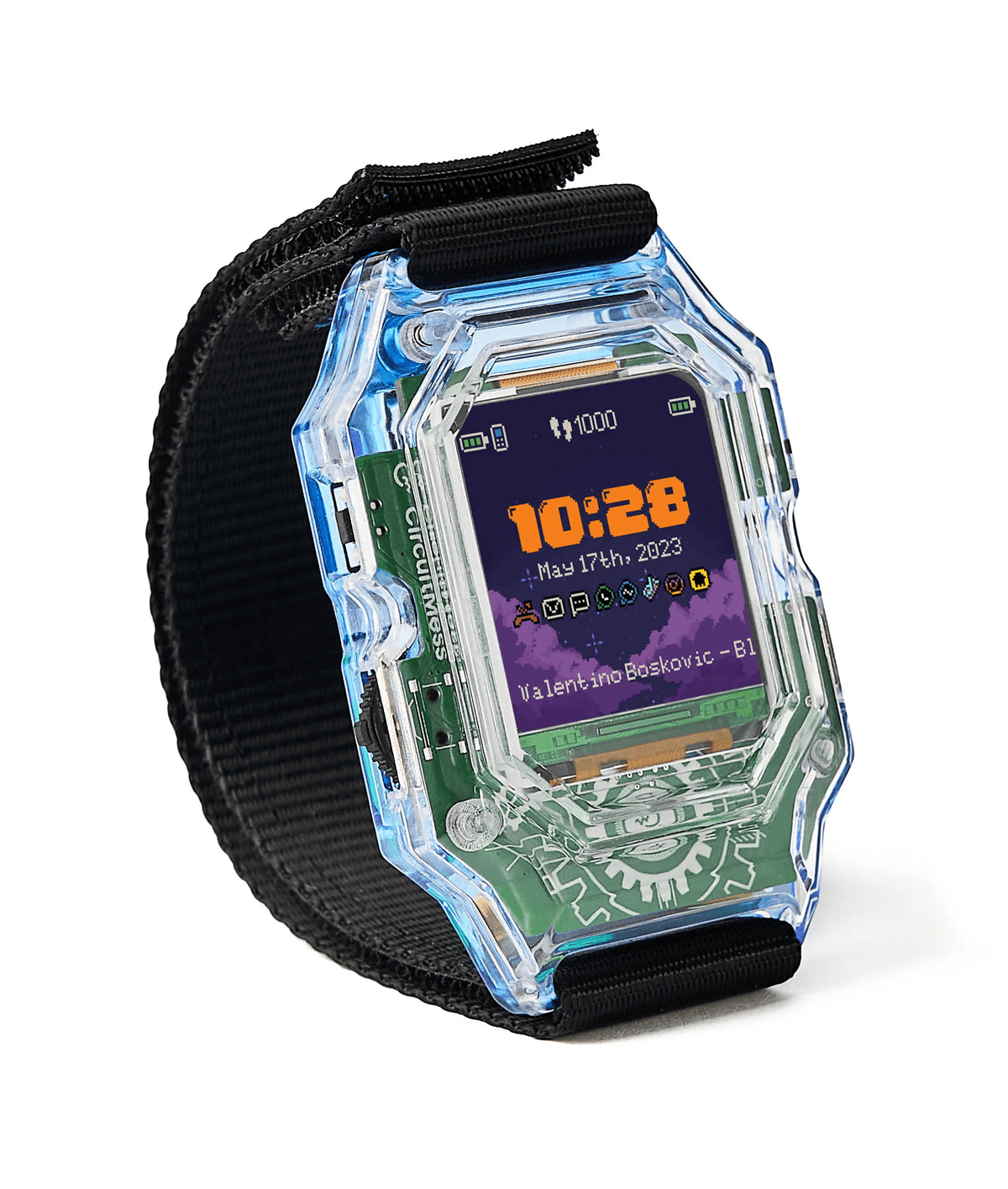 DIY smart clock with black fabric strap and transparent case, angled view showing 10:28