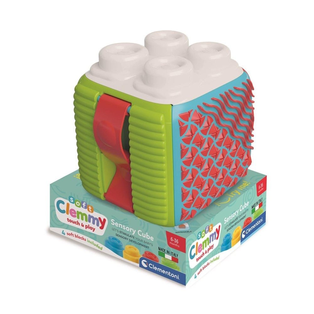 Soft sensory activity cube with white textured knobs, green panels, red and blue patterns