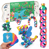 Magnetic building set pieces with colorful animal-shaped parts and instruction cards