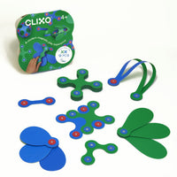Magnetic building toy set with green and blue pieces in a storage pouch