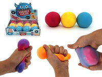 Color-changing squeeze stress balls, red, yellow, and blue spheres