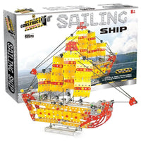 Yellow and red sailing ship model building kit with gray metal base and rigging