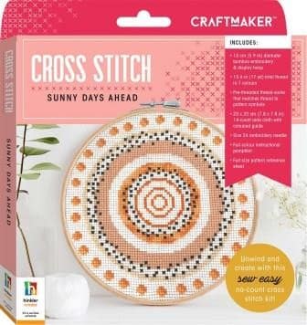 Cross-stitch kit with circular hoop pattern in orange, brown, and white