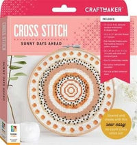 Cross-stitch kit with circular hoop pattern in orange, brown, and white
