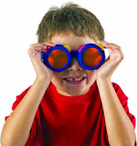 Blue color-mixing glasses with red lenses, worn by a child.
