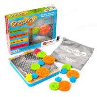 Crankity toy set in box with metal pegboard, colorful gears, and storage pouch