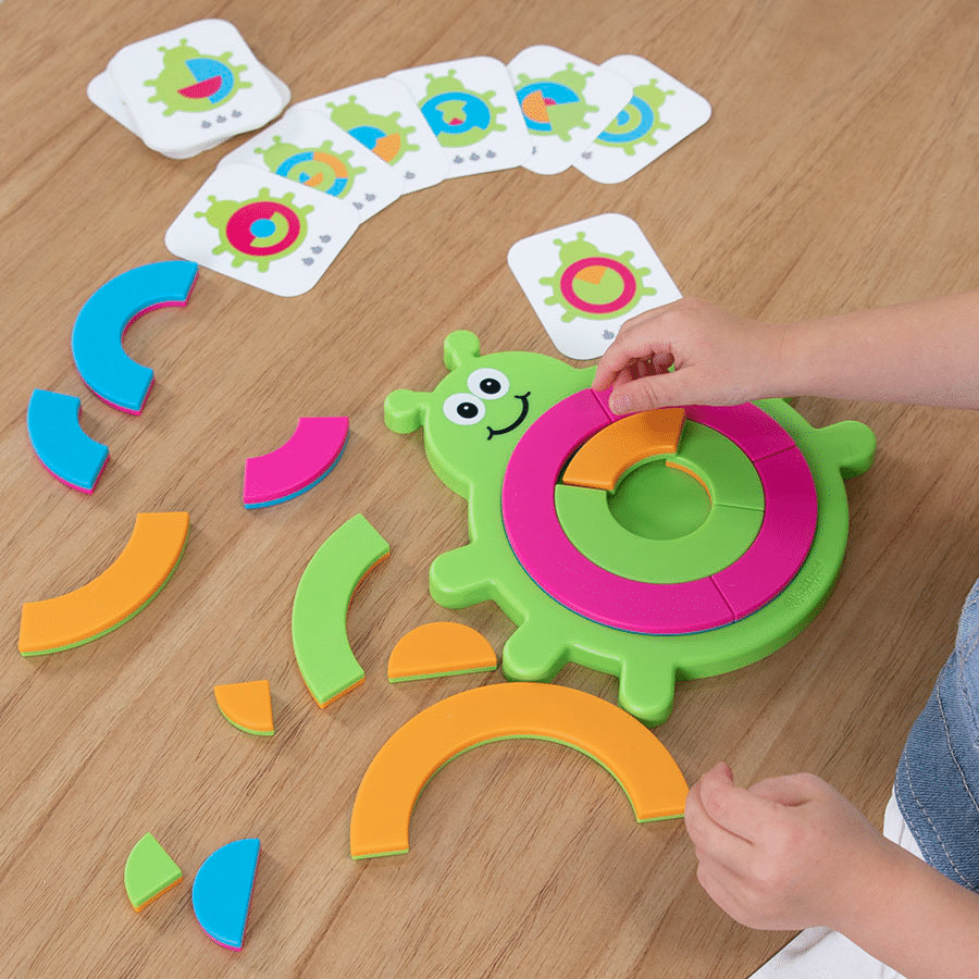 Green bug-shaped puzzle toy with multicolor circular pieces and smiling face
