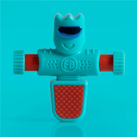 Foosbots Rora teal robot figure with red scoop front, grin face, squeeze toy