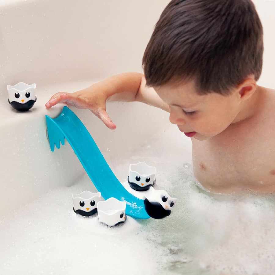 Fat Brain Toys floating bath toy: blue boat with penguin bobbers, splash-ready