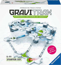 Marble run starter track set with white tiles, blue towers, and green curved ramps