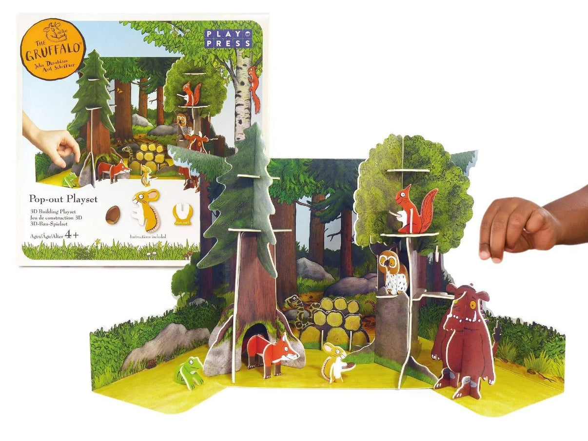 Woodland pop-out playset with animal figures, tall trees, and green base mat