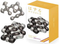 Gray metal interlocking puzzle pieces with circular cutouts