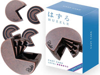 Dark brown cast metal cake puzzle pieces, curved interlocking shapes