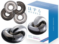 Metal donut-shaped puzzle pieces with interlocking dark gray loops