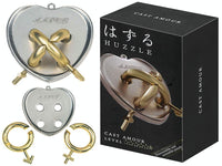 Hanayama Huzzle L5 Amour metal heart puzzle with gold bow, rings, and key pieces