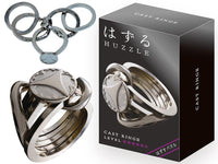 Metallic ring puzzle keychain with interlocking circular pieces and circular charms