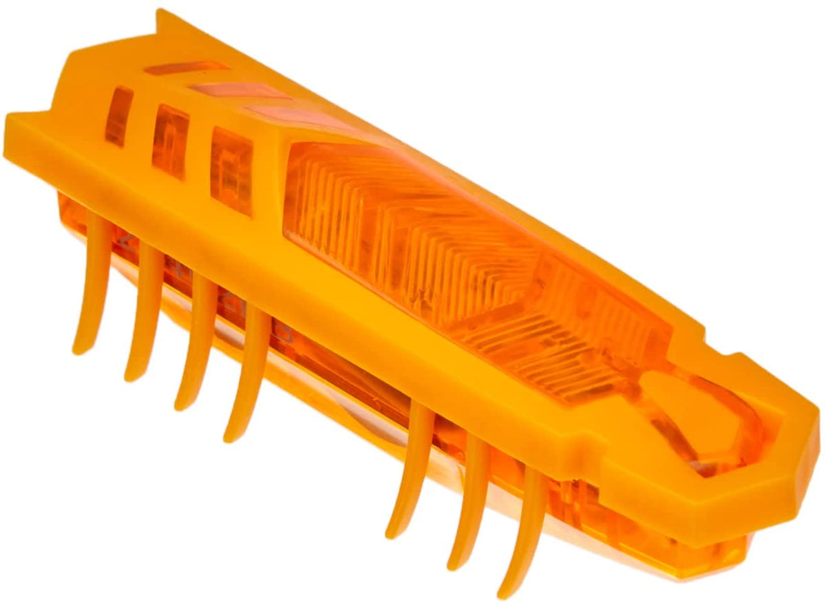 Translucent orange toy insect with spiked underside and clear top windows