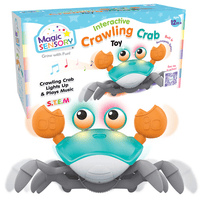 Blue crawling crab toy with teal shell, orange claws, and glowing eyes