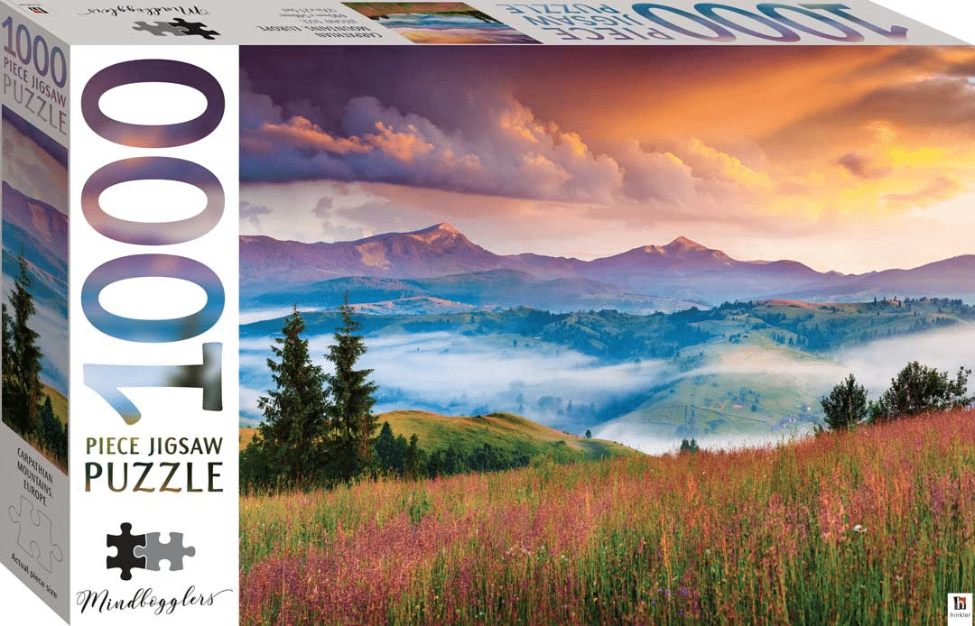 Jigsaw puzzle box featuring mountain landscape at sunrise with grassy meadow and trees