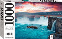 1000-piece jigsaw puzzle box with Godafoss waterfall and ocean under colorful sky