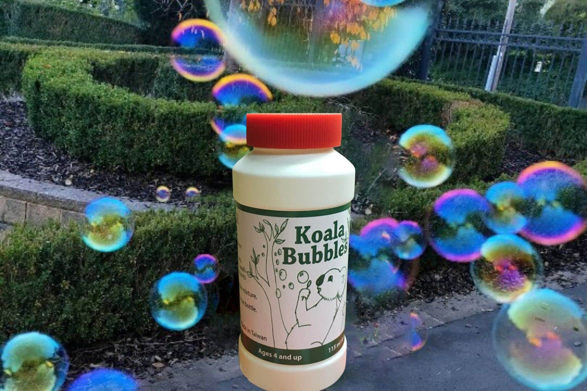 Koala Bubbles bubble bottle with red cap, showing koala and tree illustration