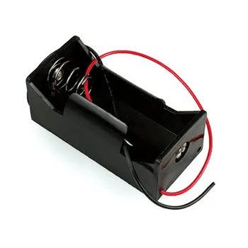 Black battery holder with red and black leads and open spring contacts