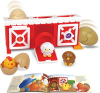 Red and white chicken coop toy with white chick, eggs, and two brown chicks