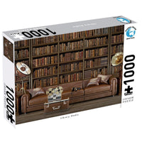 1000-piece jigsaw puzzle box with library bookshelves, couch, suitcase and owl graphic