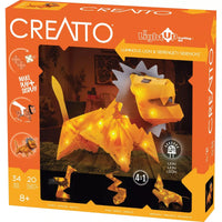 Light-up lion construction kit box with orange branding and glowing lion artwork