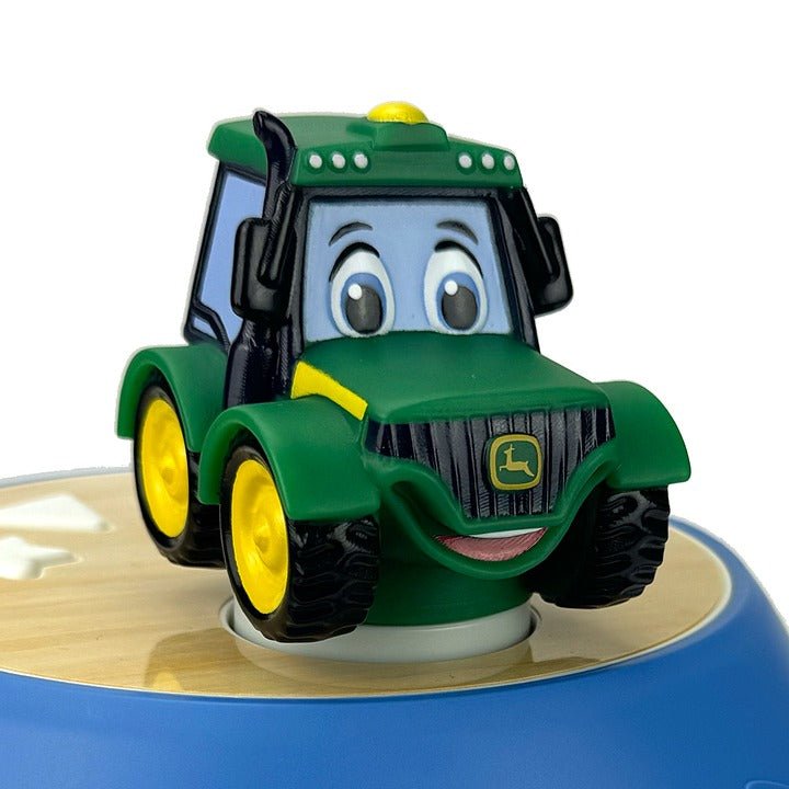 John Deere tractor door press on round base, green cab character with smiling face