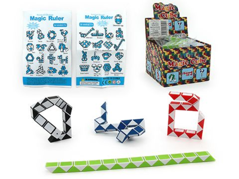 Boxed cube snake puzzle set with sample snake shapes in black, blue, red, green