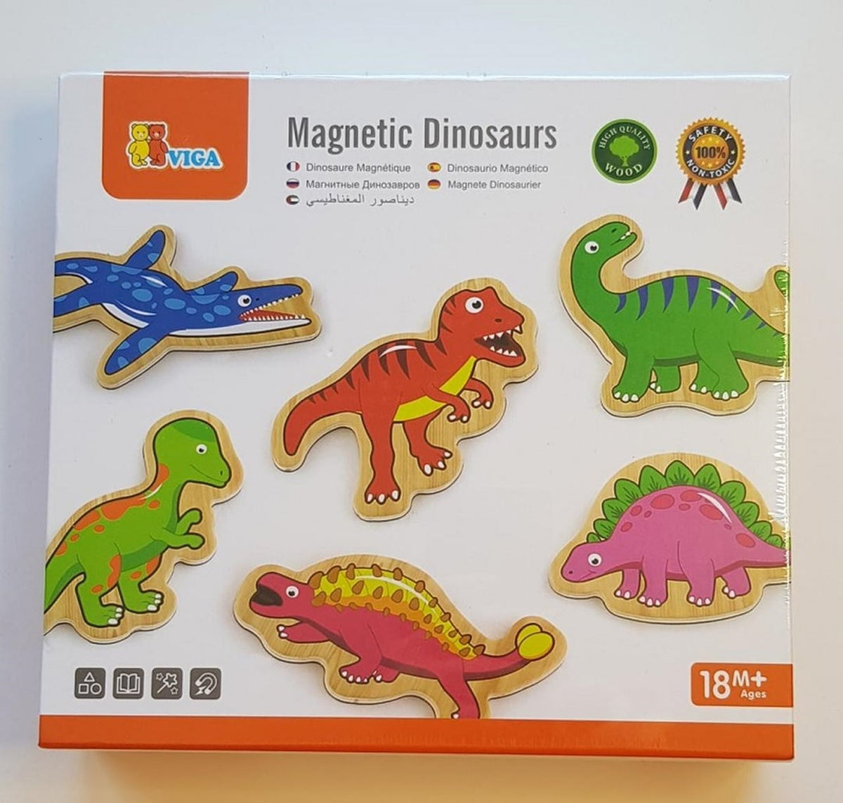 Magnetic dinosaur toy set on box, colorful dinosaur cutout figures