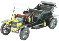 Dark green metal open-top model car with yellow engine and spoked wheels