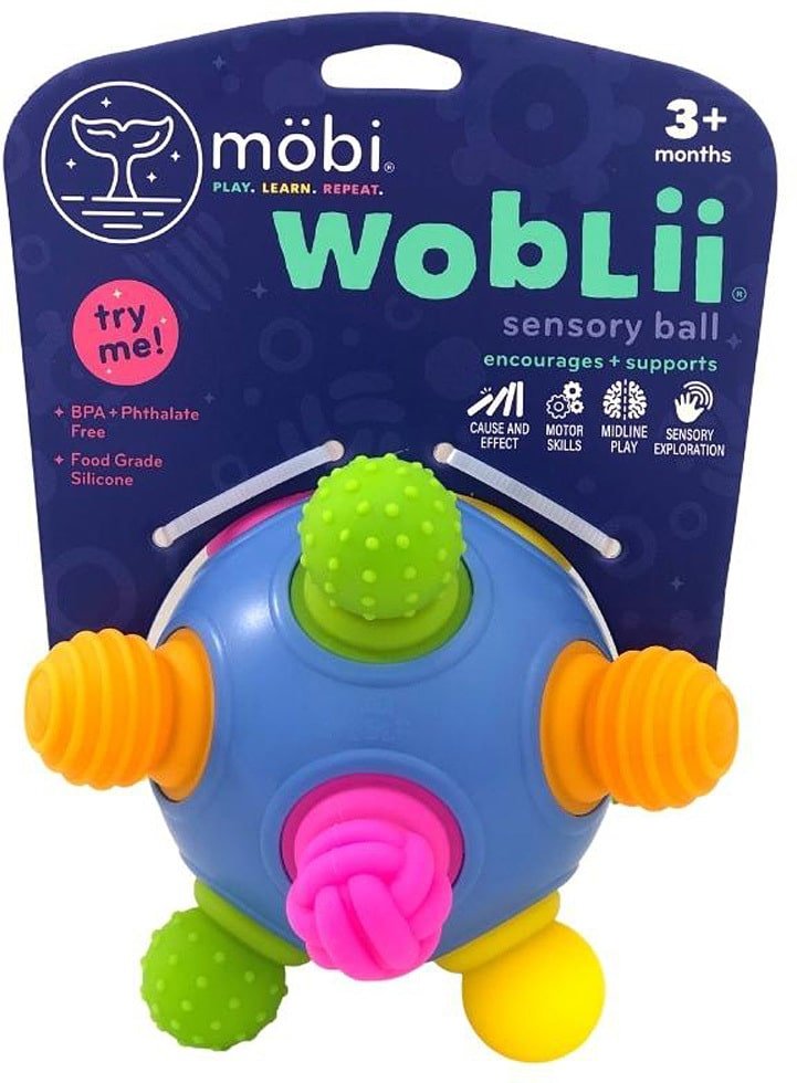 Blue sensory ball toy with green and orange nubs and a pink textured panel