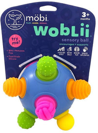 Blue sensory ball toy with green and orange nubs and a pink textured panel