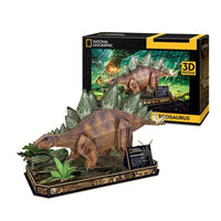 Stegosaurus 3D paper model with brown body, gray plates, and green plants on base