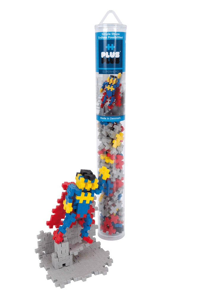 Superhero building set tube with assembled hero figure and multicolor interlocking pieces