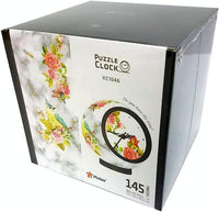 Puzzle clock product box with floral clock artwork and printed clock window.