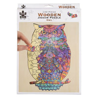 Wooden jigsaw puzzle owl, colorful multicolor print on light wood board