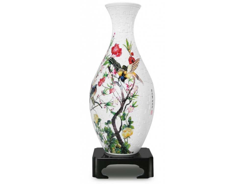 Decorative white vase with colorful birds, flowers, and tree-branch design