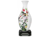 Decorative white vase with colorful birds, flowers, and tree-branch design