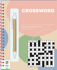 Spiral crossword puzzle notebook with pen and crossword grid