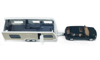 Siku 1:55 metal Porsche car and caravan set, caravan open with dark vehicle.